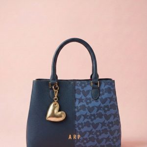 Bolso mano Agatha Ruiz de la Prada doble estampado azul